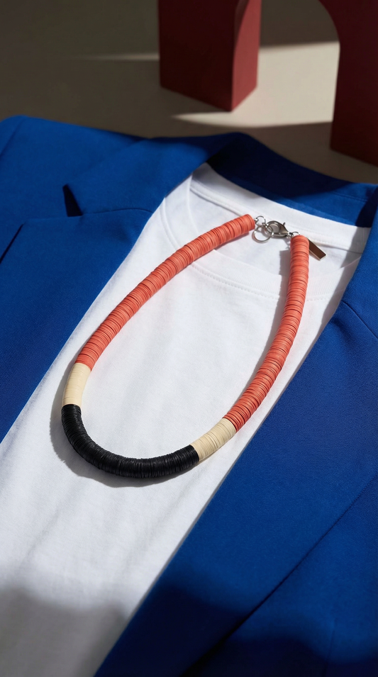 Round orange, cream, and black necklace