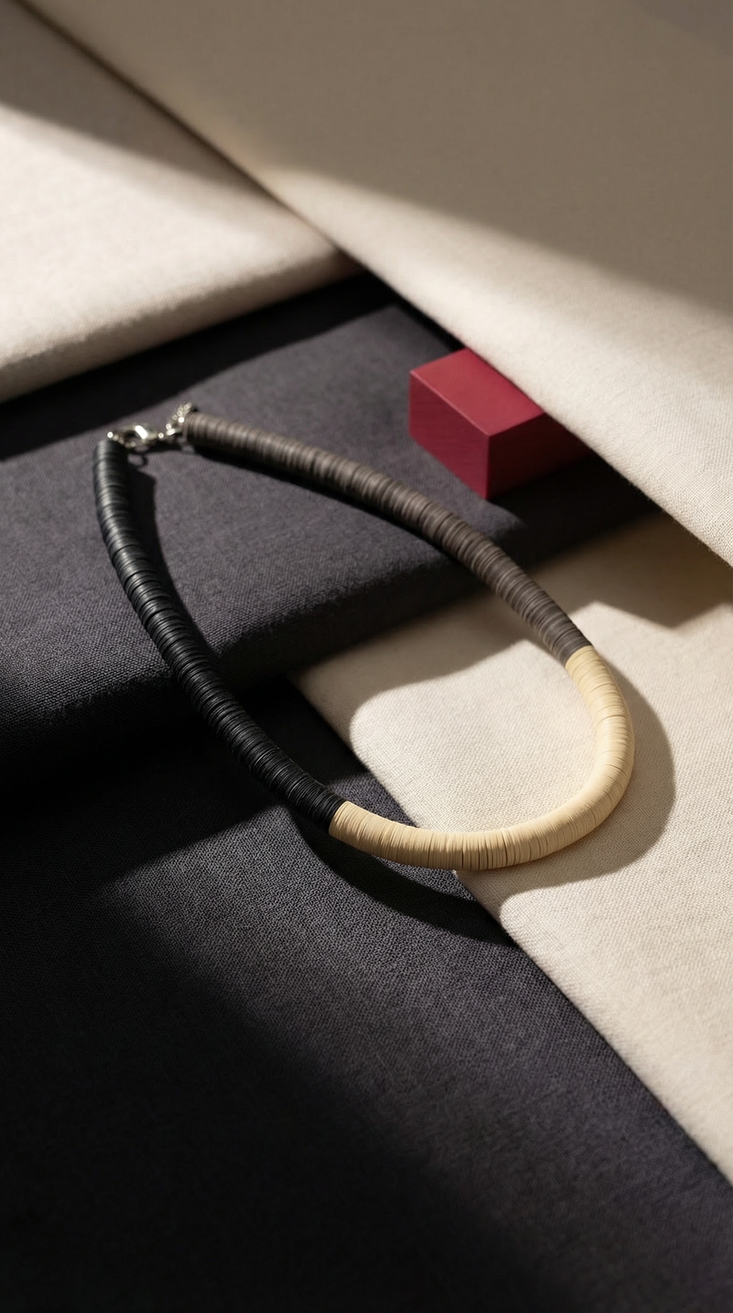 Black, cream, and Fendi round necklace