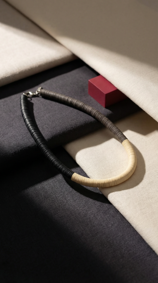 Black, cream, and Fendi round necklace