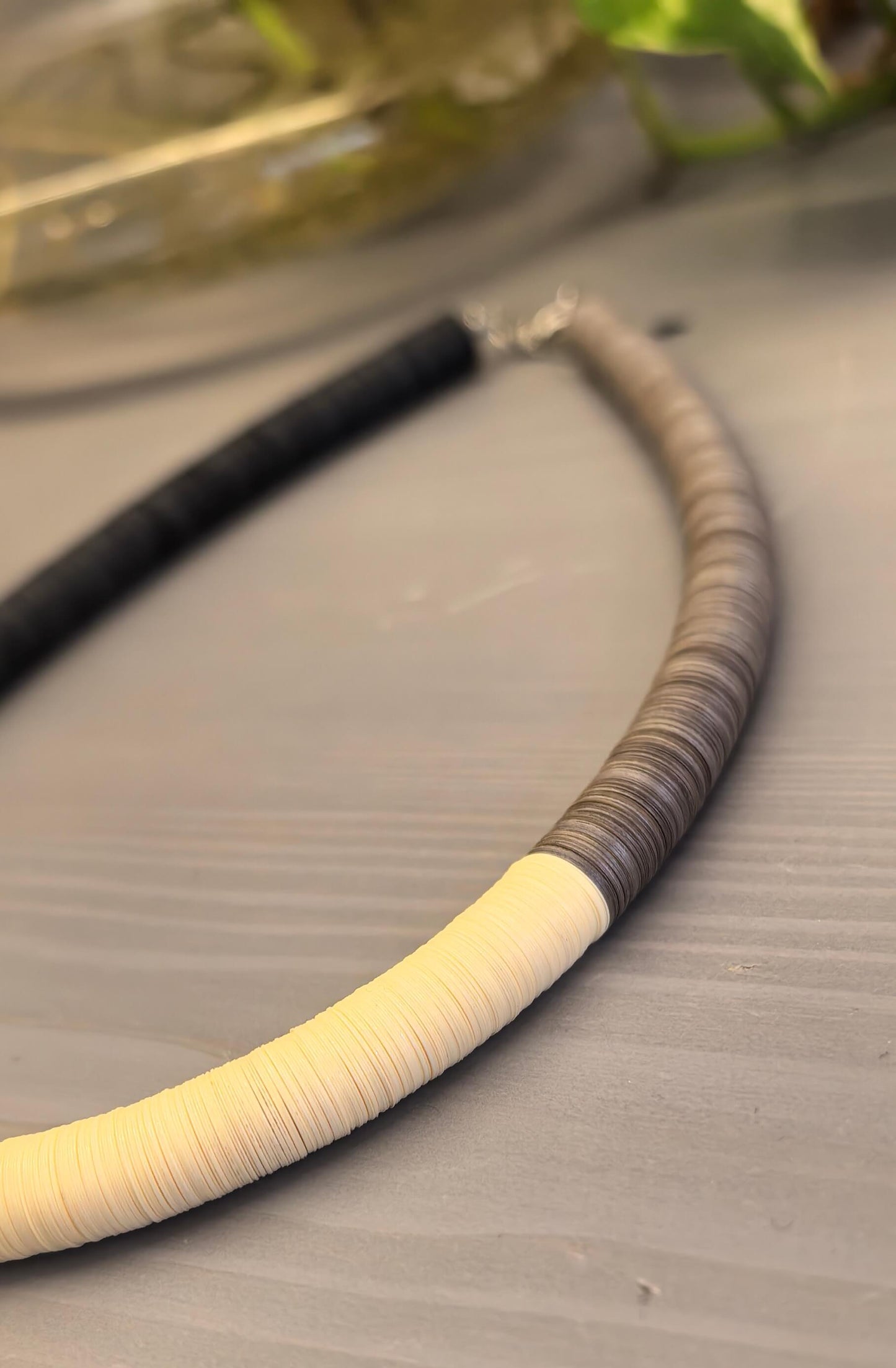 Black, cream, and Fendi round necklace