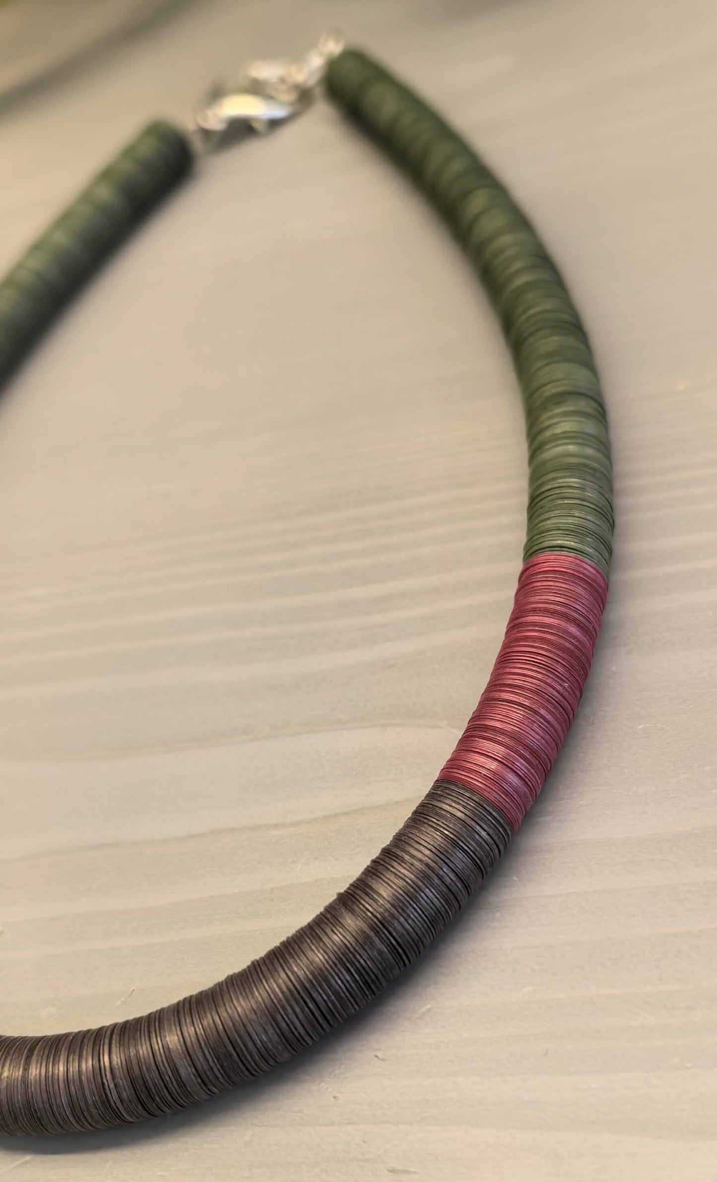 Green, burgundy, and brown round necklace