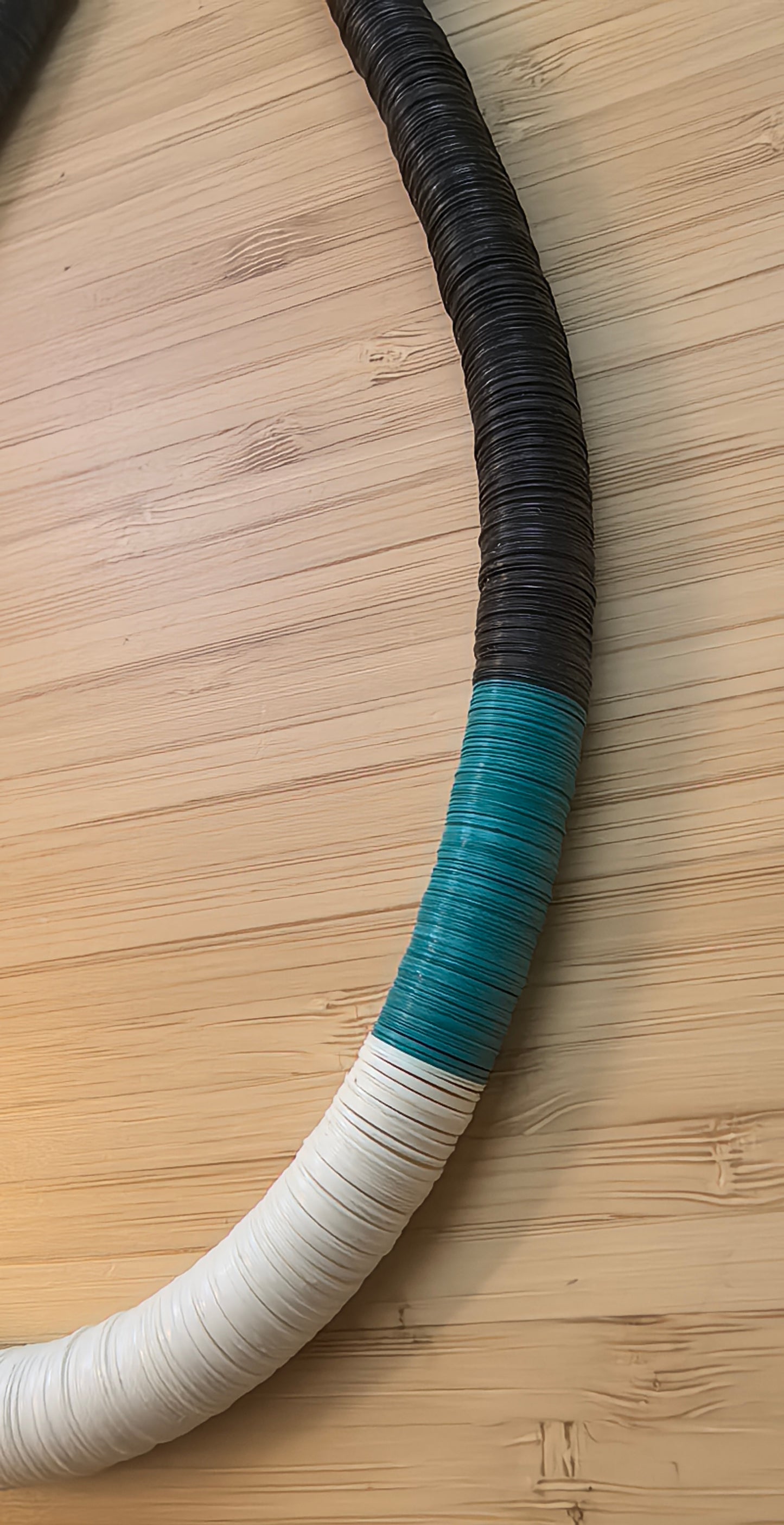 Round necklace in black, turquoise, and off-white