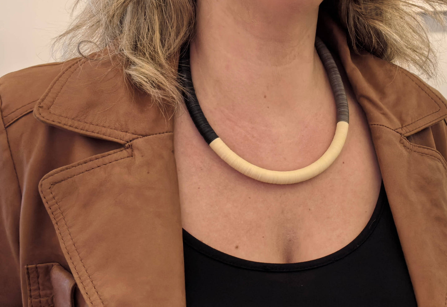 Black, cream, and Fendi round necklace