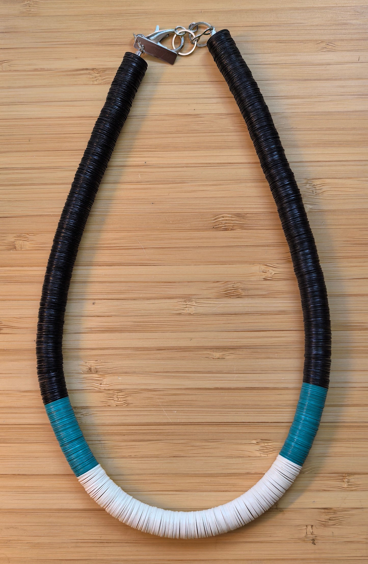 Round necklace in black, turquoise, and off-white