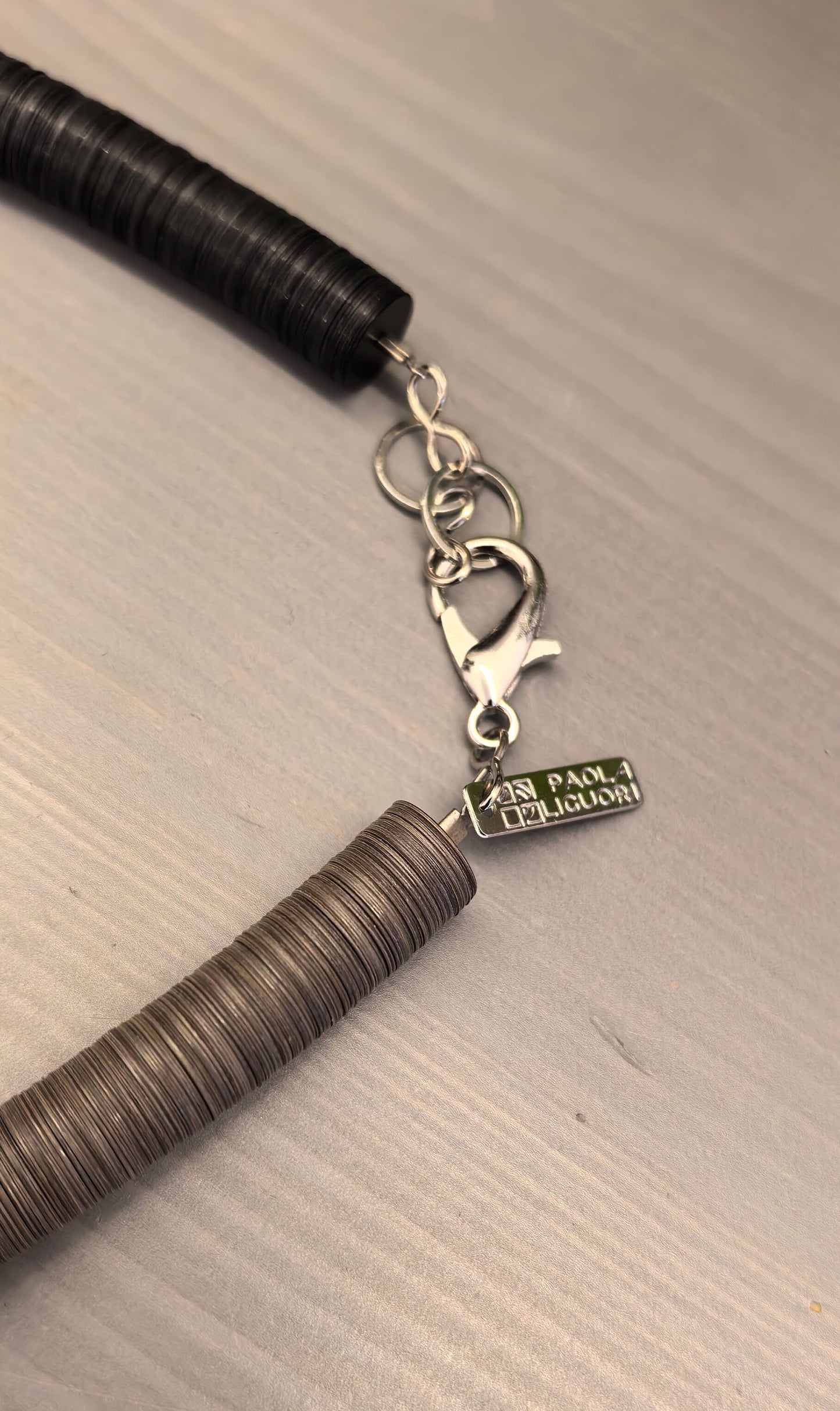 Black, cream, and Fendi round necklace